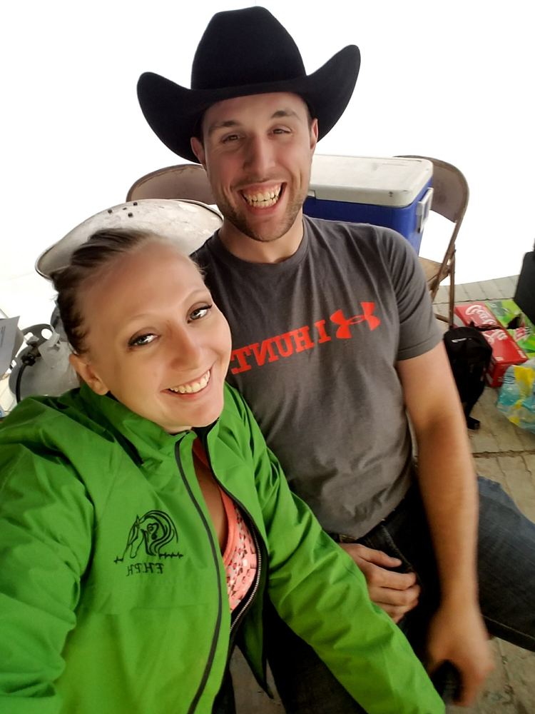Alena in a green F.H.P.H. jacket and Matthew in a black cowboy hat at an early show